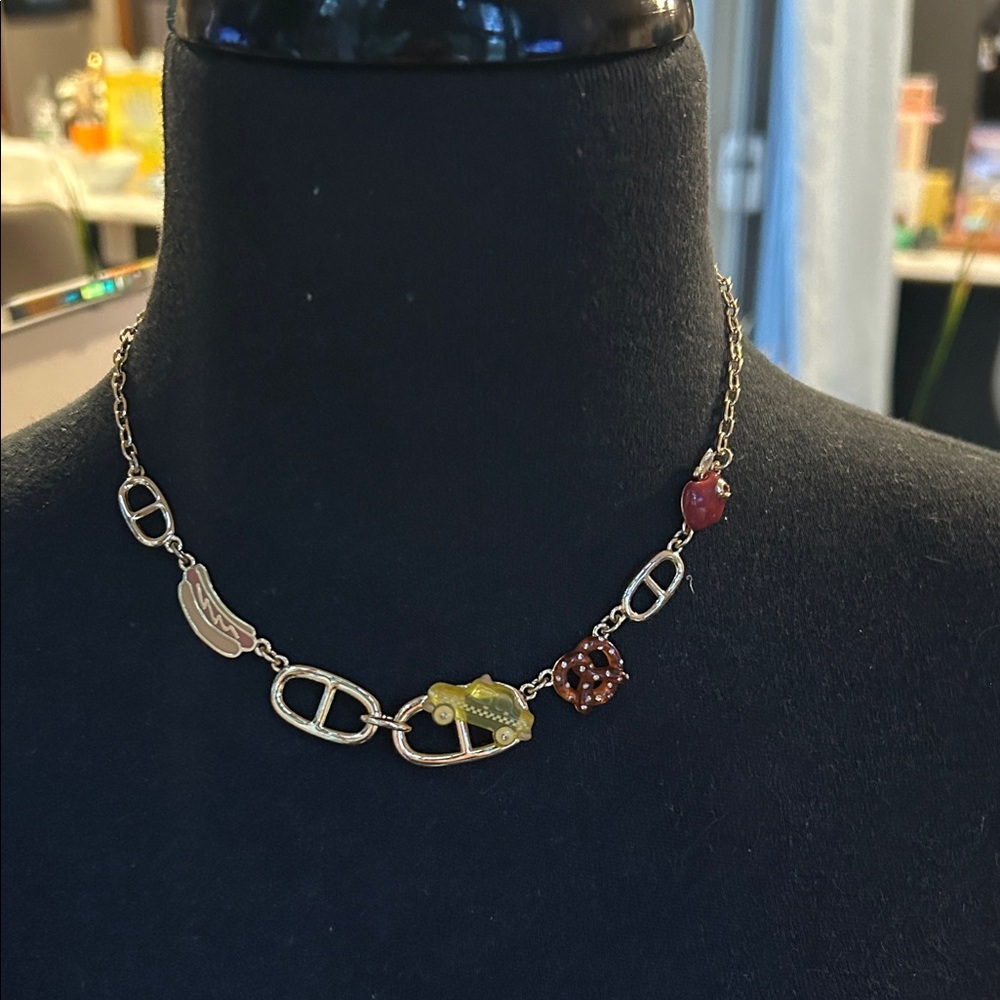 COACH NEW YORK  Gold Tone Necklace with Multicolor iconic "NY" charms.